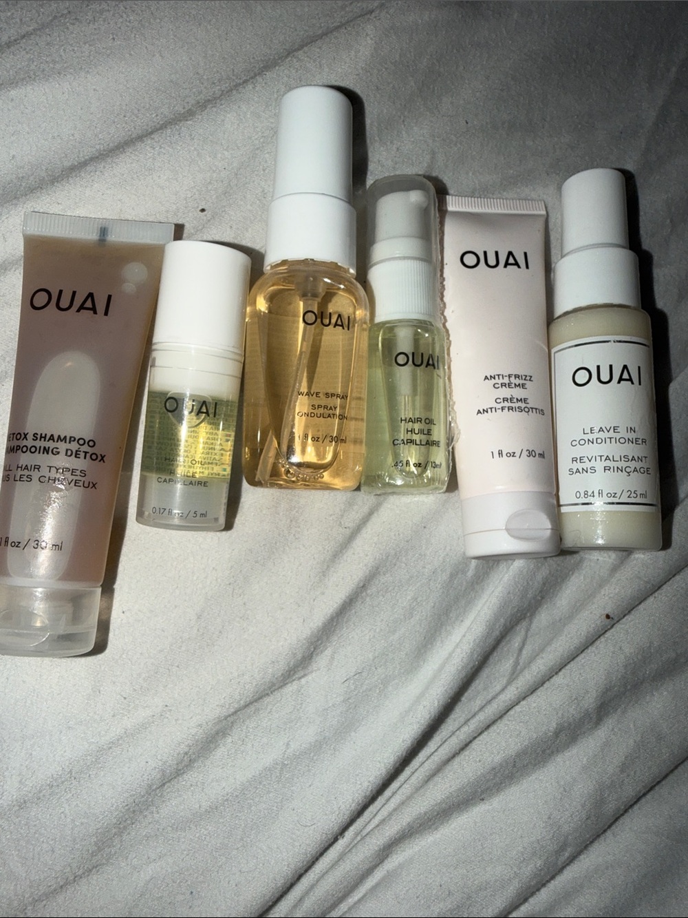 OUAI Travel Hair Set — Neutral & Pale Pink Bottles